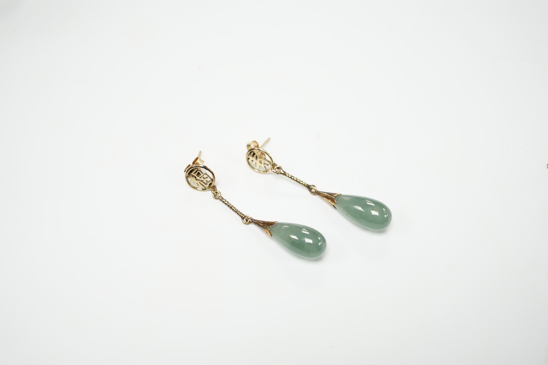 A pair of Chinese yellow metal and jade set drop earrings, 45mm, gross weight 5.7 grams.